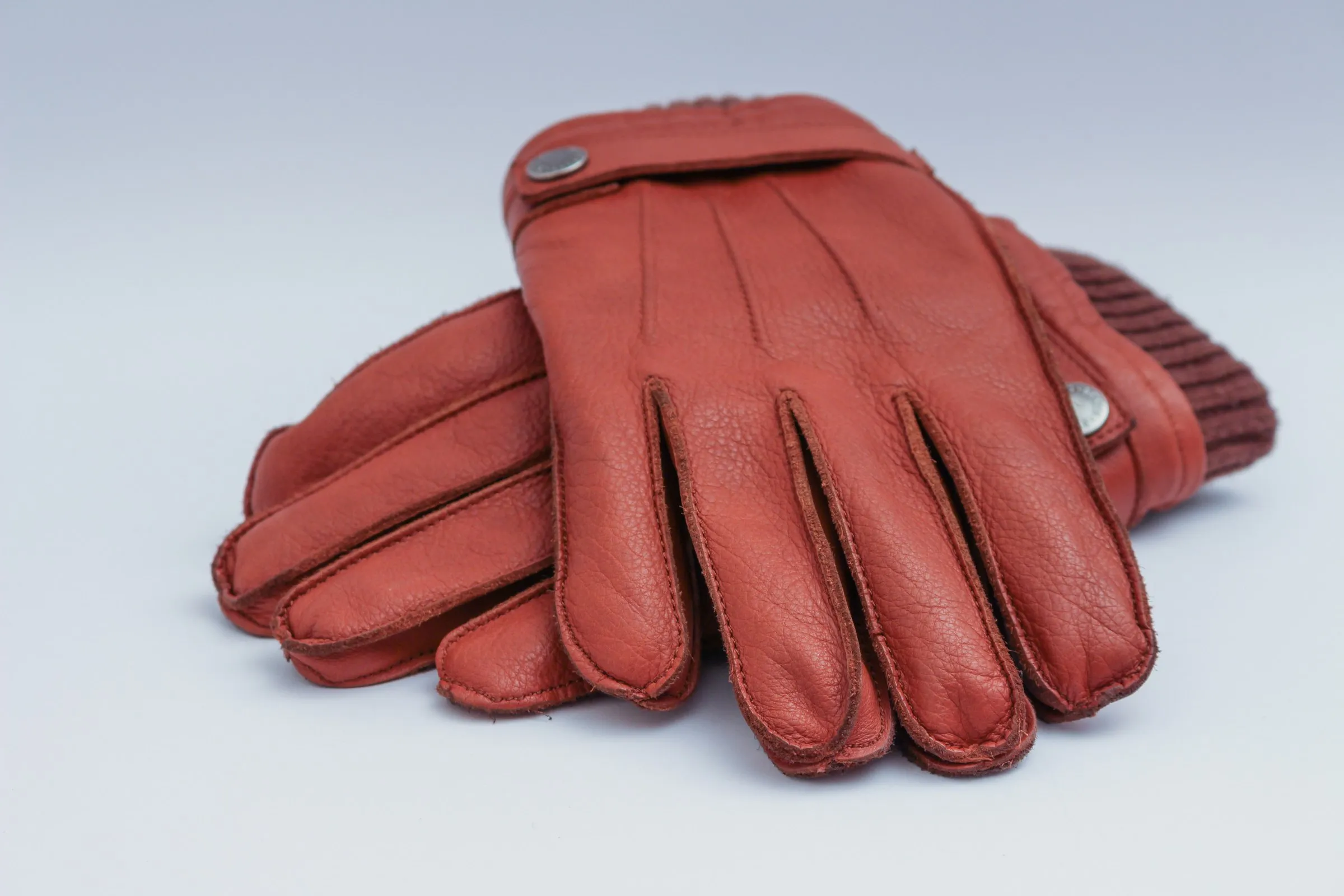Hands in sewn work gloves