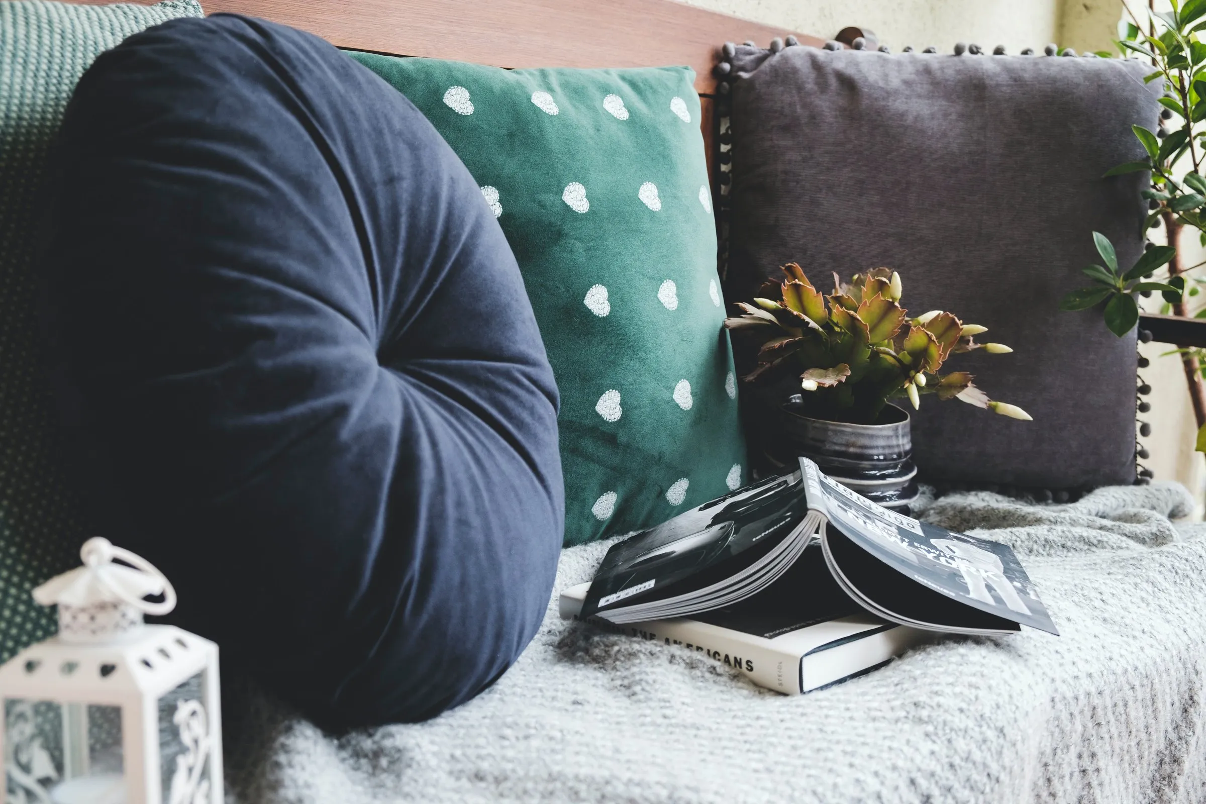 Decorative sewn pillows on a sofa