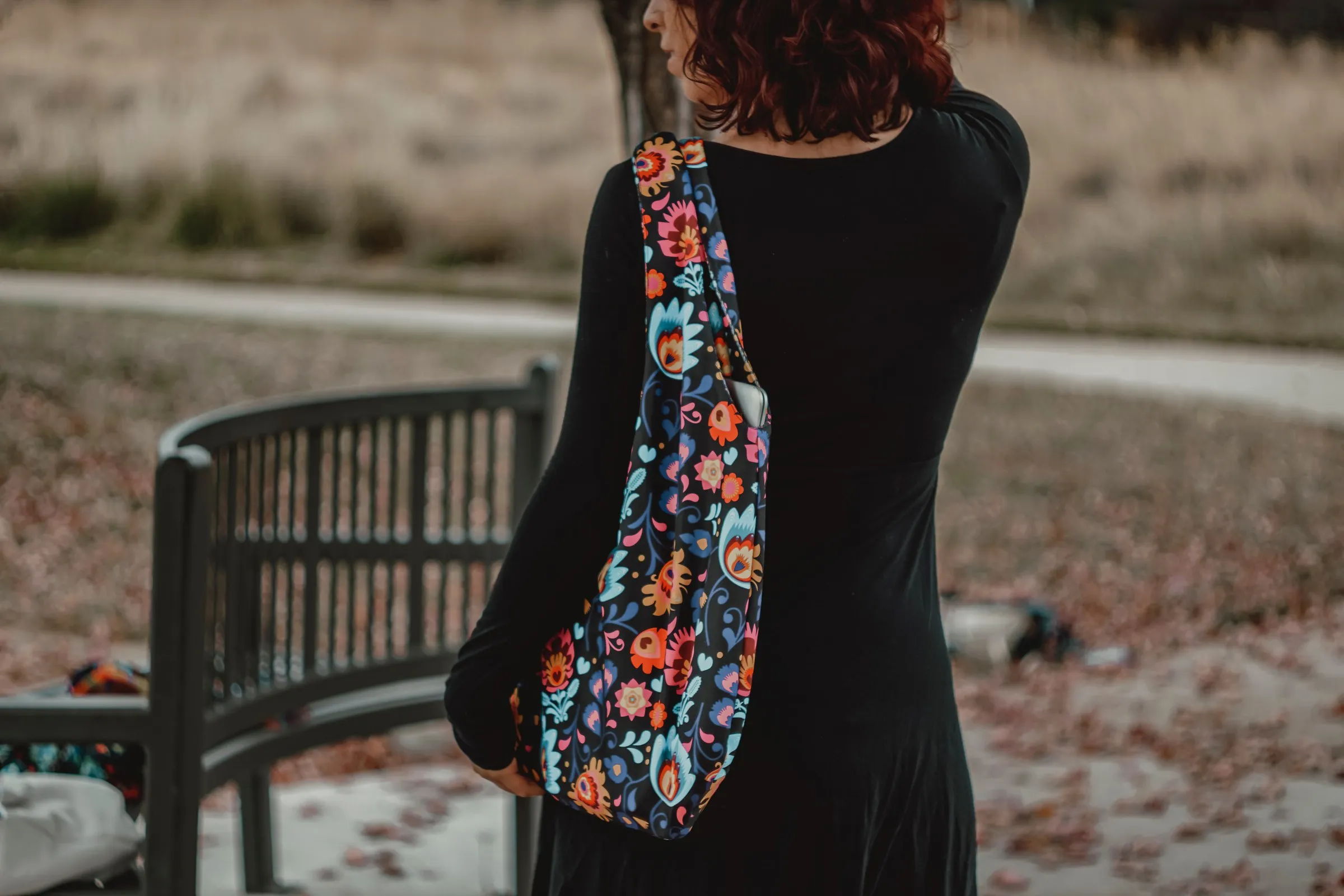 Woman carrying a patterned fabric handbag