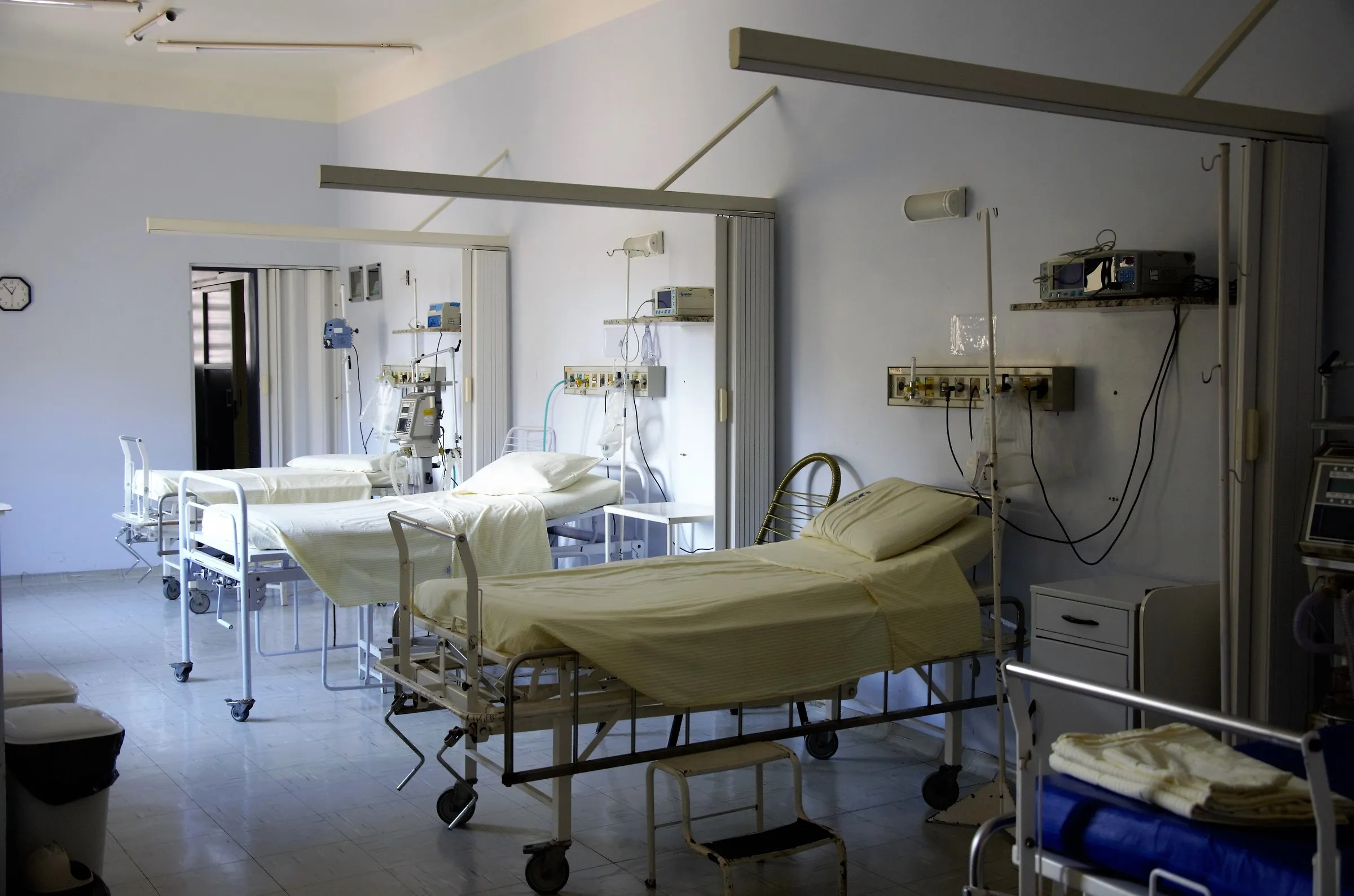 Hospital beds with fitted bedding