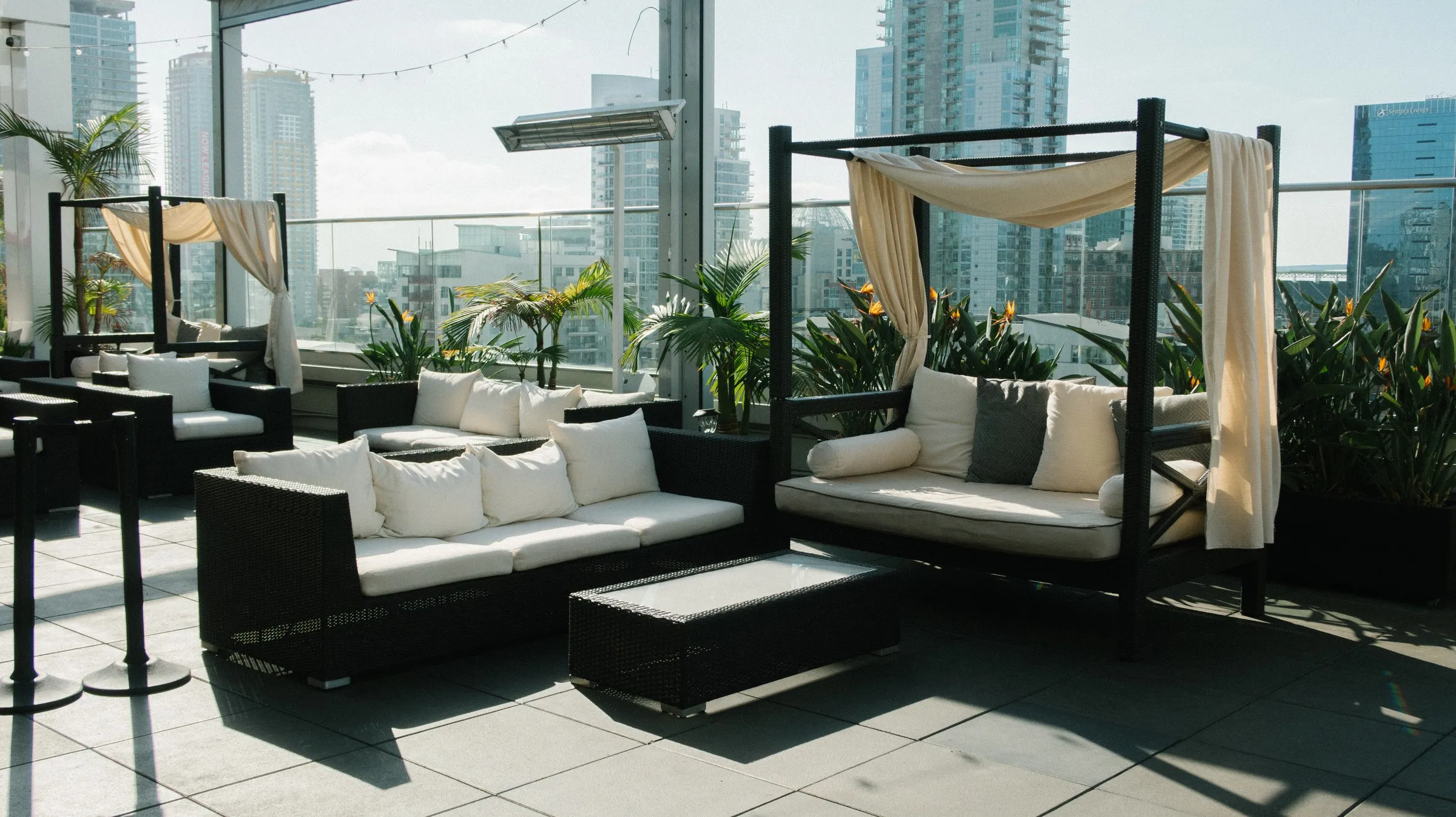 Rooftop cabanas with upholstered cushions