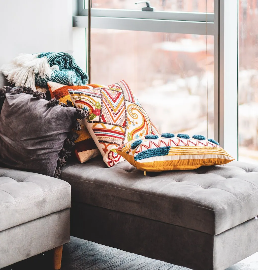 Patterned throw pillows on a window seat