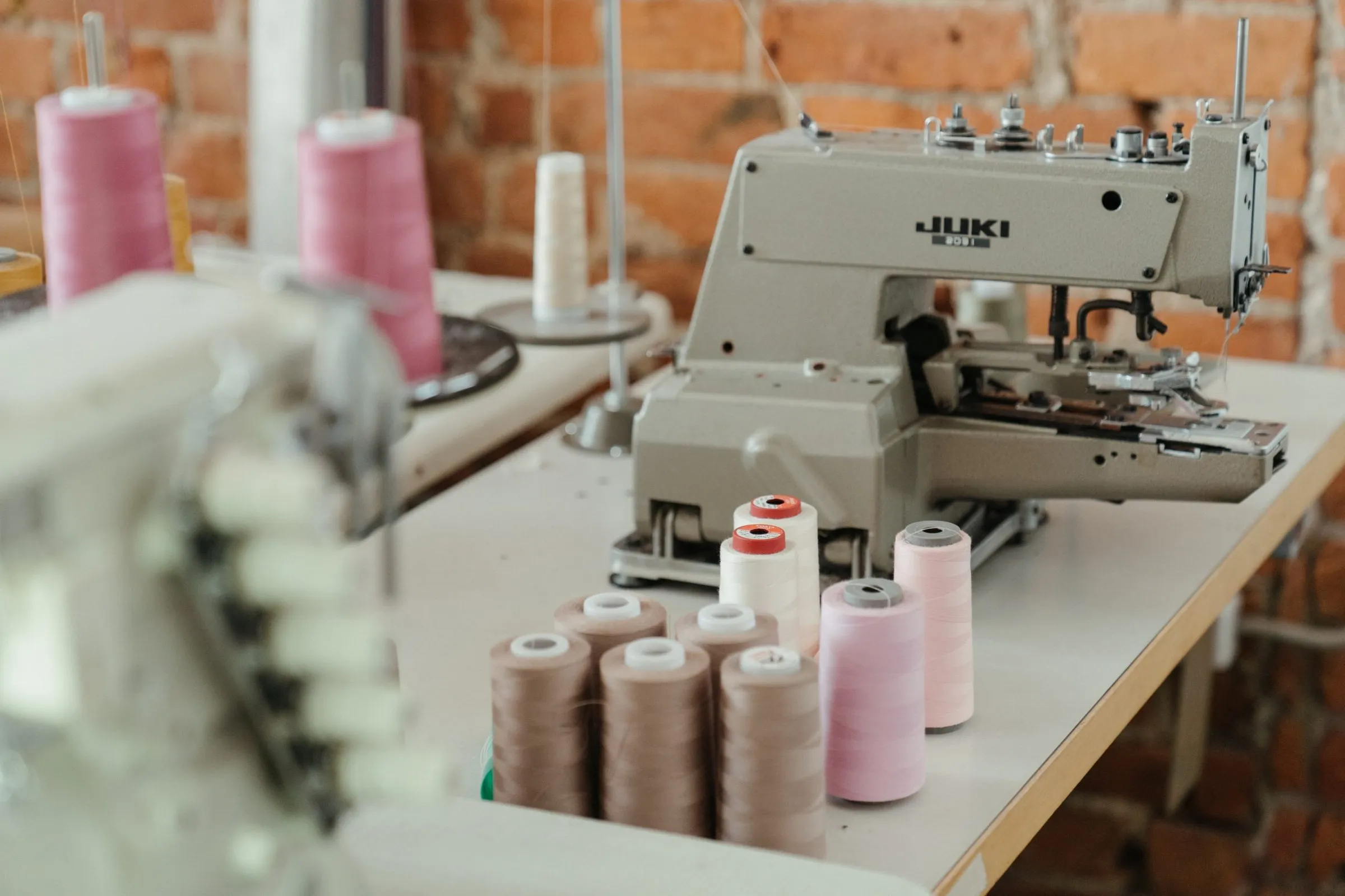 Industrial sewing machines in a garment workshop